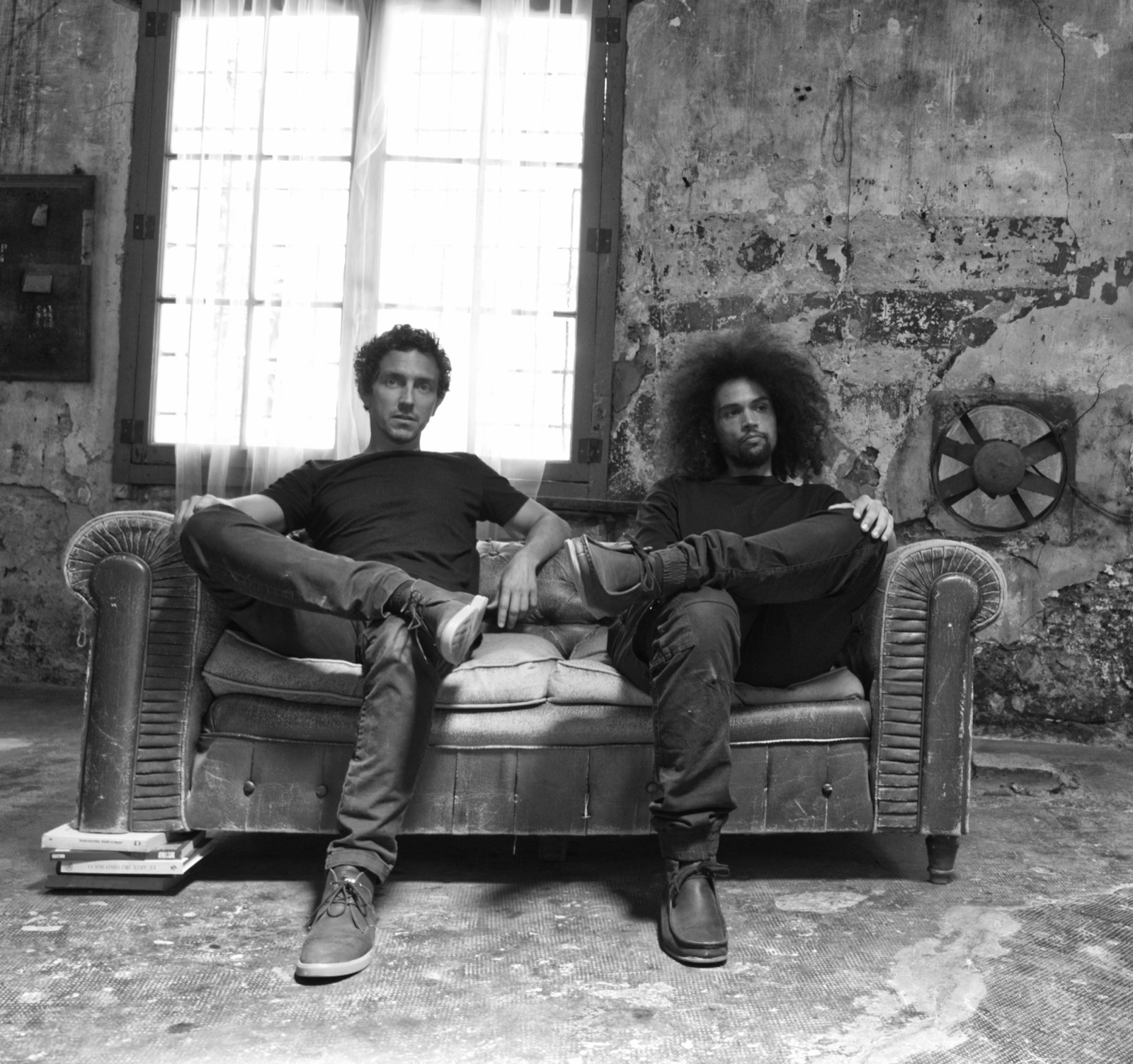 Wild Bounce on a worn sofa in a bare Barcelona room