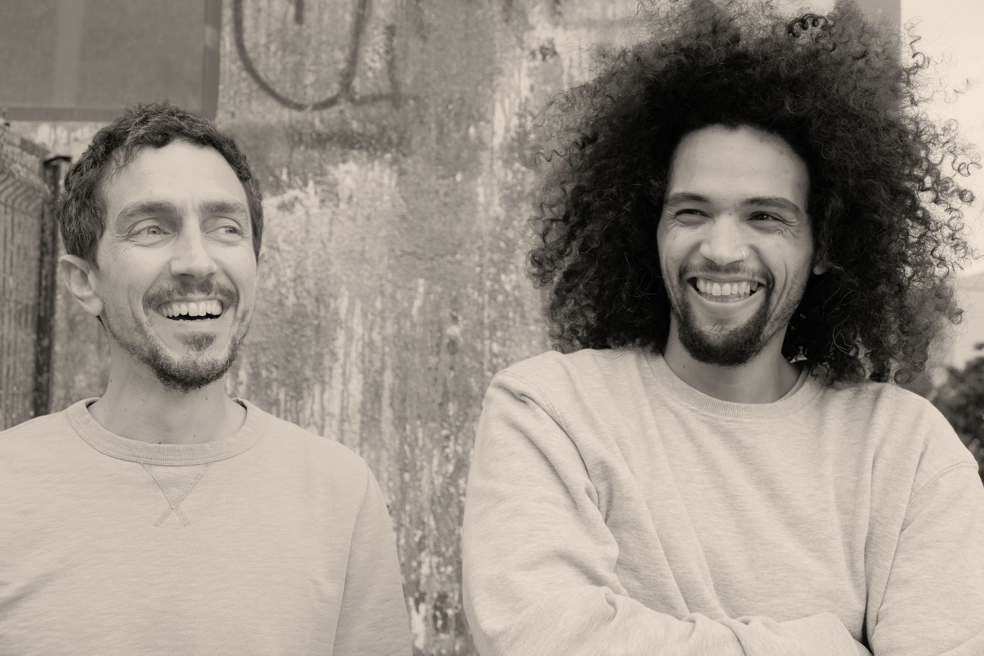 Wild Bounce — Daniele Carmosino and MaBreeZee against a weathered wall in Barcelona